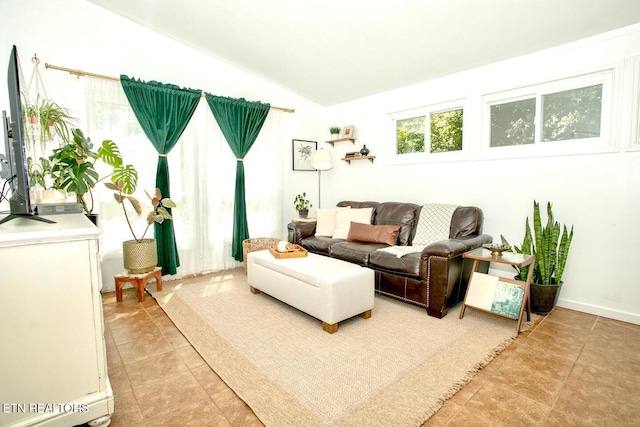 1340 Sumac Dr, Knoxville, TN 37919 - living room featuring vaulted ceiling and light tile patterned flooring