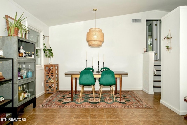 1340 Sumac Dr, Knoxville, TN 37919 - tiled dining area with ornamental molding and baseboards