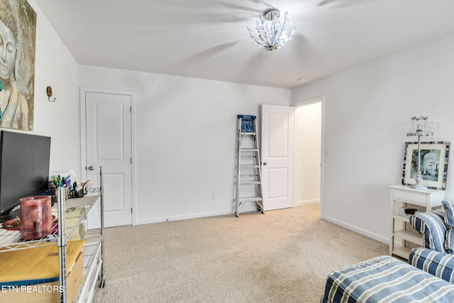 living area with baseboards and carpet floors