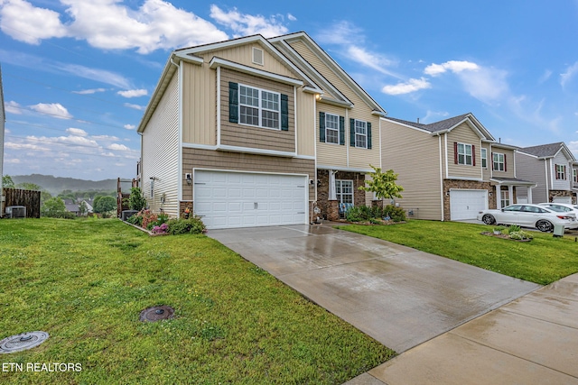 view of front of property with central air condition unit, stone siding, a front lawn, concrete driveway, and an attached garage