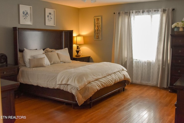 bedroom featuring wood finished floors