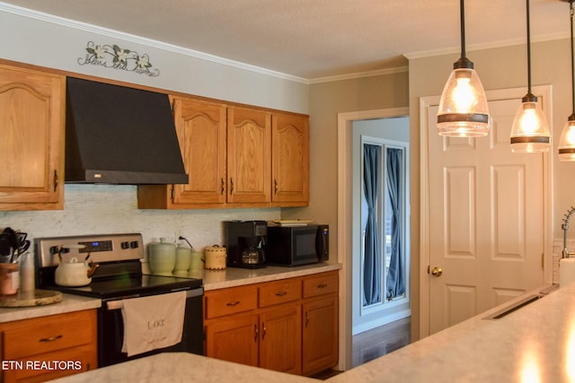 kitchen with wall chimney range hood, pendant lighting, stainless steel electric range oven, black microwave, and light countertops