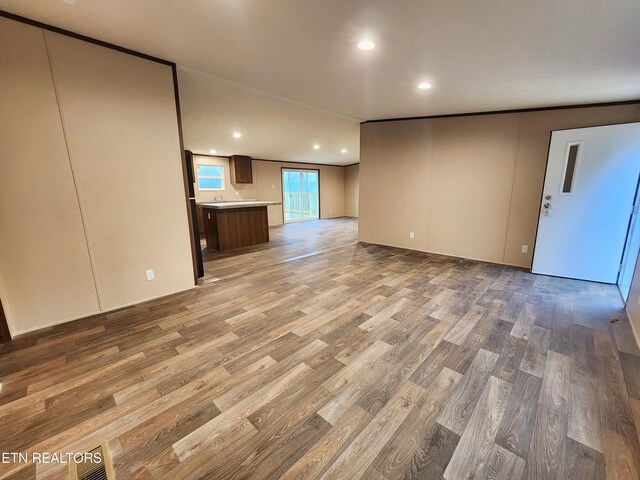 unfurnished living room with light wood-style floors and recessed lighting
