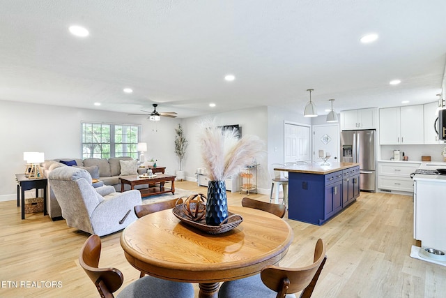 dining area with recessed lighting, ceiling fan, baseboards, and light wood-style floors