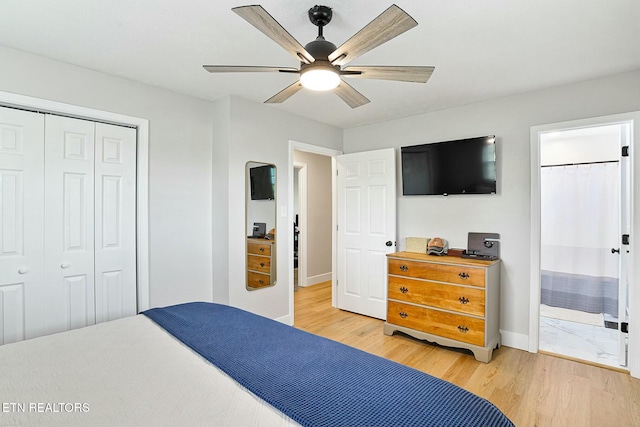 bedroom with ceiling fan, a closet, baseboards, light wood finished floors, and ensuite bath
