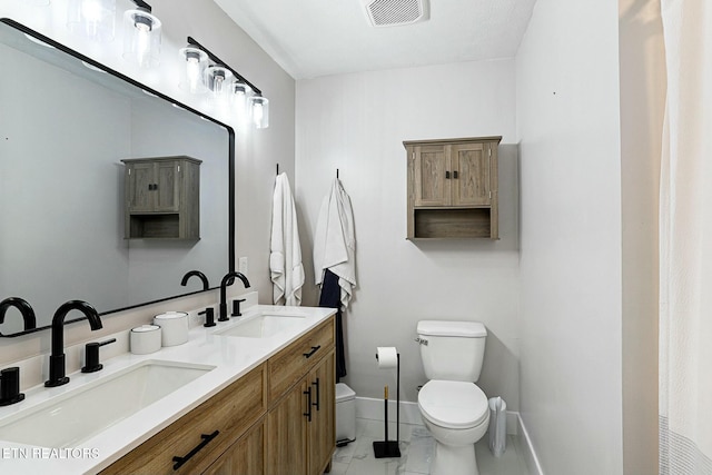 full bath featuring toilet, a sink, baseboards, and visible vents