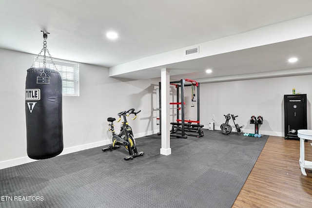 exercise area with recessed lighting, visible vents, and baseboards