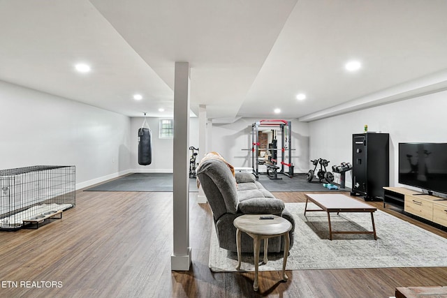living area featuring recessed lighting, wood finished floors, and baseboards