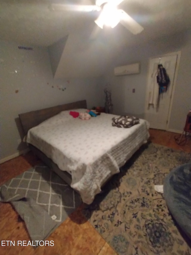 210 Wilson Ave, Mountain City, TN 37683 - bedroom with a wall mounted AC and ceiling fan