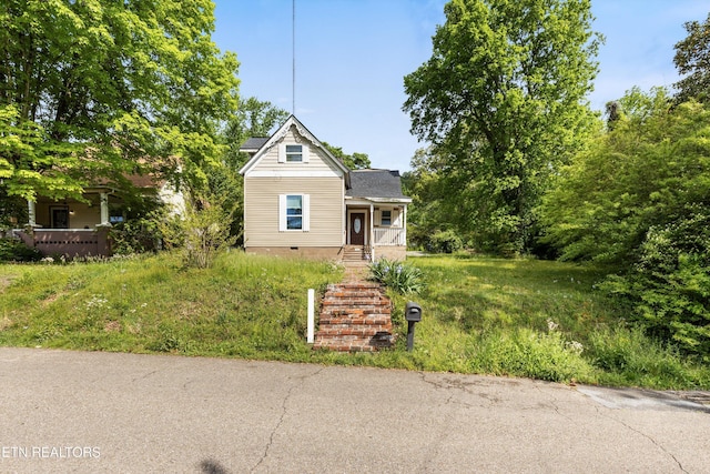 view of front of home featuring covered porch and crawl space