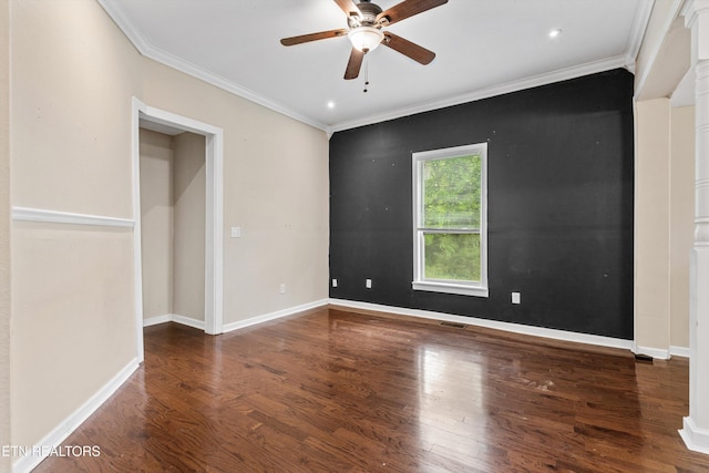 unfurnished bedroom featuring baseboards, visible vents, wood finished floors, and crown molding