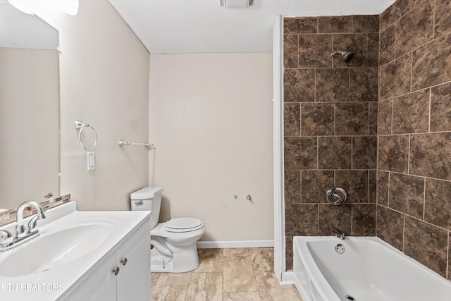 bathroom featuring toilet, vanity,  shower combination, and baseboards