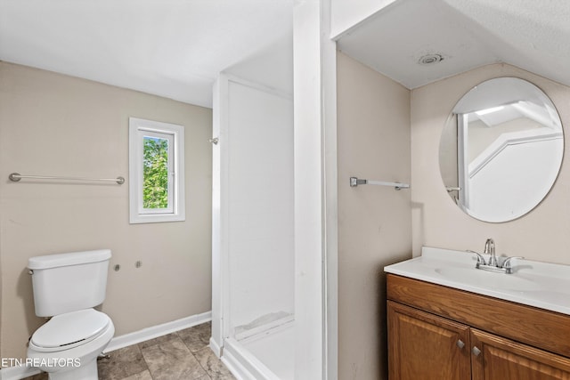 full bath featuring toilet, vanity, a shower stall, and baseboards