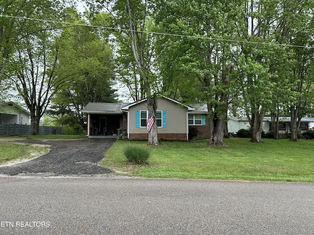 131 Oak Hill Dr, Jamestown, TN 38556 - view of front of house with driveway, fence, a front yard, and brick siding