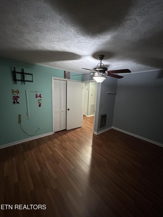 131 Oak Hill Dr, Jamestown, TN 38556 - spare room featuring a ceiling fan, baseboards, wood finished floors, and a textured ceiling