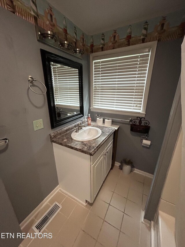 131 Oak Hill Dr, Jamestown, TN 38556 - bathroom featuring tile patterned flooring, visible vents, vanity, and baseboards