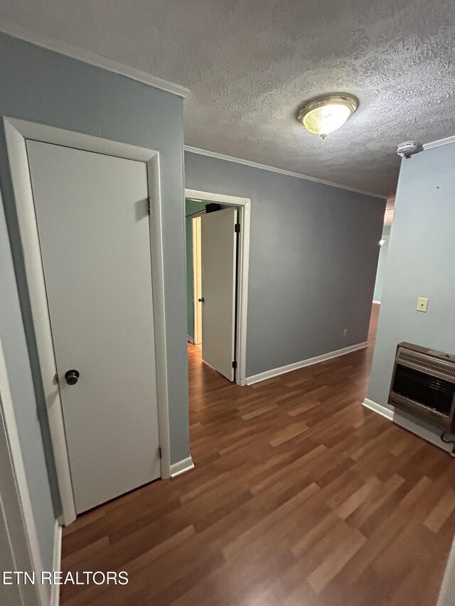131 Oak Hill Dr, Jamestown, TN 38556 - interior space with crown molding, heating unit, wood finished floors, and baseboards
