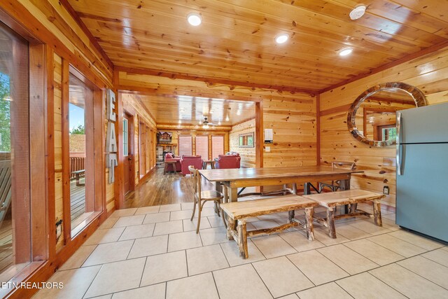 3238 Smoky Ridge Way, Sevierville, TN 37862 - dining room with light tile patterned floors, wood ceiling, recessed lighting, and wood walls
