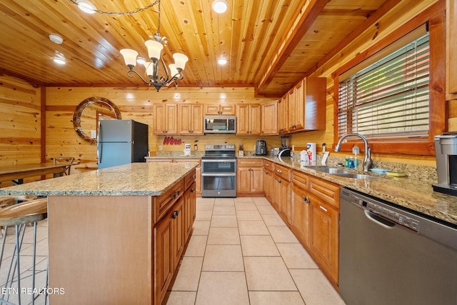 3238 Smoky Ridge Way, Sevierville, TN 37862 - kitchen with stainless steel appliances, light tile patterned floors, wooden ceiling, and a sink