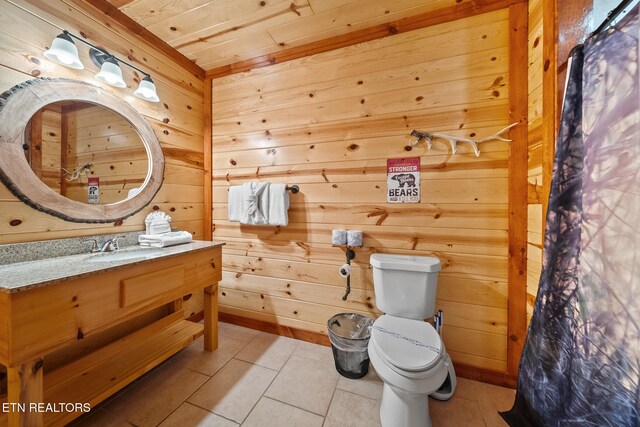 3238 Smoky Ridge Way, Sevierville, TN 37862 - bathroom featuring tile patterned flooring, wood walls, toilet, and vanity