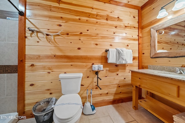 3238 Smoky Ridge Way, Sevierville, TN 37862 - bathroom with toilet, tile patterned floors, wood walls, and vanity