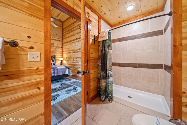 3238 Smoky Ridge Way, Sevierville, TN 37862 - full bathroom with tile patterned floors, a shower stall, wood walls, and connected bathroom