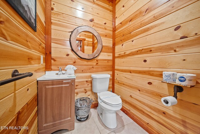 3238 Smoky Ridge Way, Sevierville, TN 37862 - half bathroom with wooden walls, vanity, tile patterned flooring, and toilet
