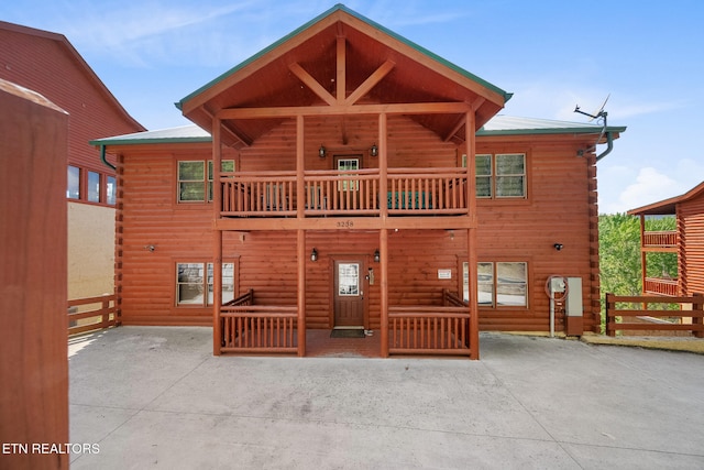 3238 Smoky Ridge Way, Sevierville, TN 37862 - rear view of house featuring fence, a balcony, and log siding