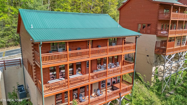 3238 Smoky Ridge Way, Sevierville, TN 37862 - back of property with a balcony, central air condition unit, metal roof, and log siding