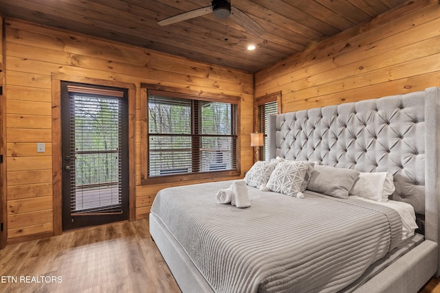 bedroom featuring recessed lighting, wooden walls, wood finished floors, and wood ceiling
