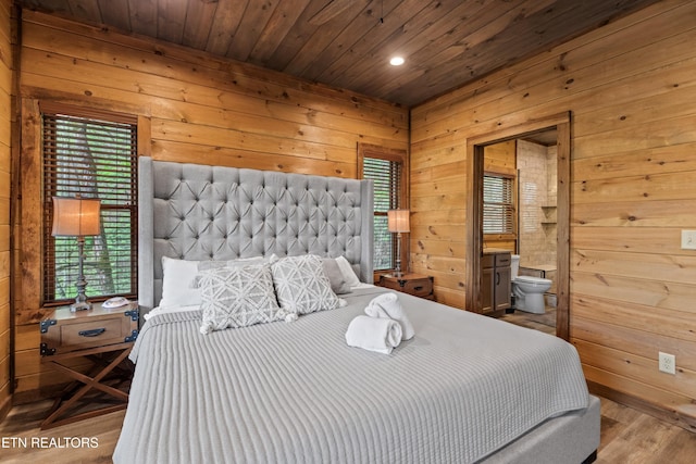 bedroom with wood finished floors, wooden ceiling, wood walls, and recessed lighting