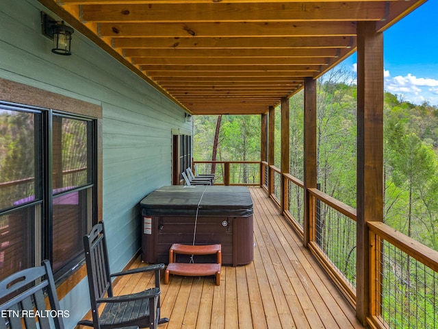deck with a hot tub