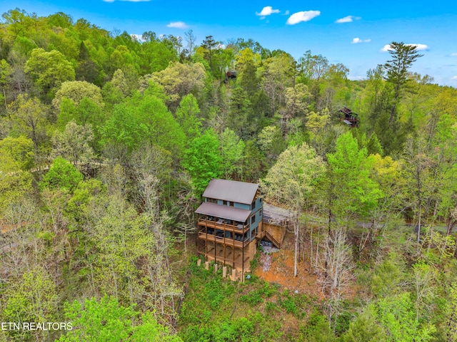 aerial view with a wooded view