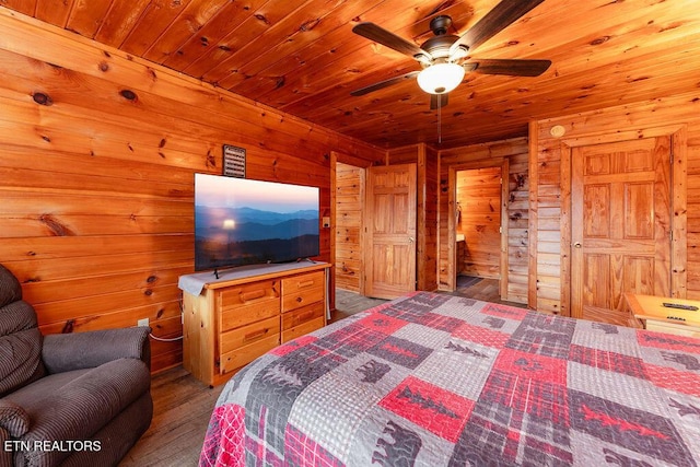 1218 Sugar Loaf Rd, Sevierville, TN 37876 - bedroom featuring wood finished floors, ceiling fan, wooden walls, and wood ceiling