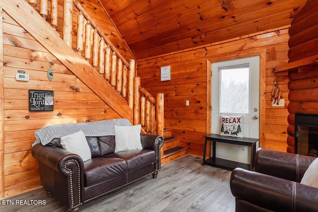 1218 Sugar Loaf Rd, Sevierville, TN 37876 - living room featuring wooden walls, stairs, and wood finished floors