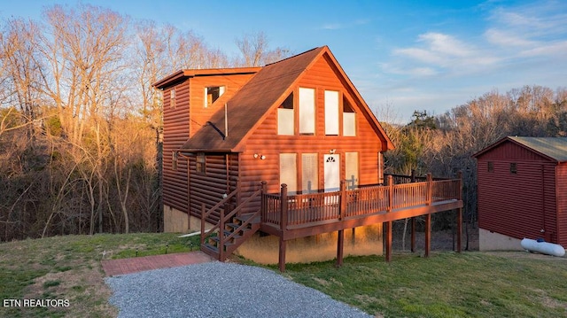 1218 Sugar Loaf Rd, Sevierville, TN 37876 - back of property featuring a deck, log veneer siding, and a yard