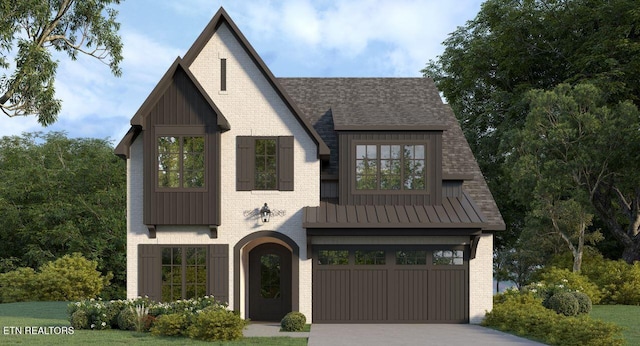 modern farmhouse style home featuring driveway, board and batten siding, a standing seam roof, metal roof, and a garage