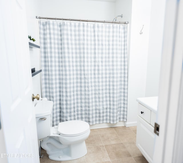 full bathroom featuring shower / tub combo, toilet, tile patterned flooring, and vanity