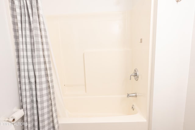 full bath featuring shower / bathtub combination with curtain
