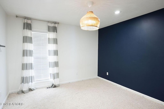 carpeted empty room with baseboards and recessed lighting