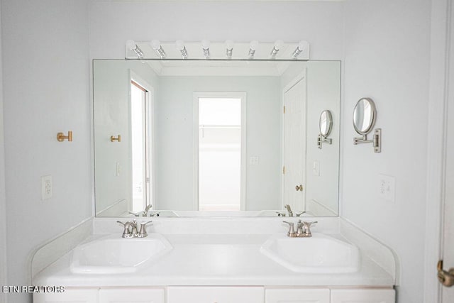 bathroom with double vanity and a sink