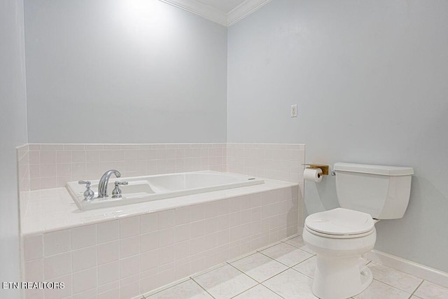 bathroom featuring a garden tub, tile patterned floors, toilet, baseboards, and ornamental molding