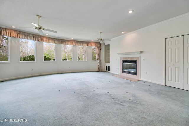 662 Laurel Cir, Crossville, TN 38555 - unfurnished living room with a tile fireplace, ornamental molding, recessed lighting, and ceiling fan