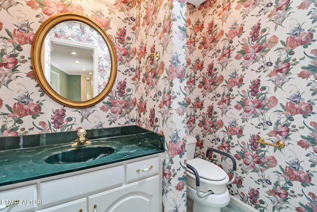 662 Laurel Cir, Crossville, TN 38555 - bathroom with wallpapered walls, vanity, and toilet