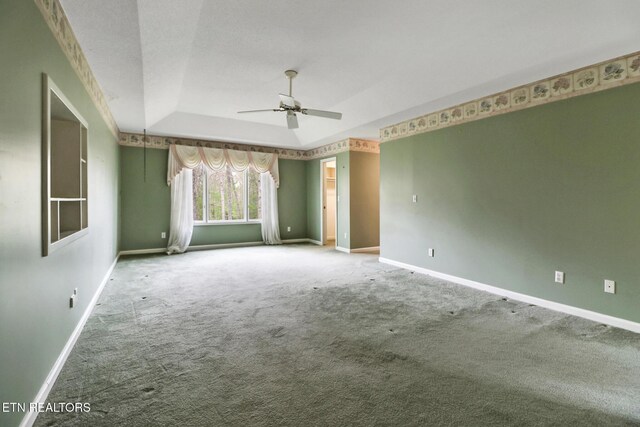662 Laurel Cir, Crossville, TN 38555 - unfurnished room featuring baseboards, a ceiling fan, carpet flooring, and a raised ceiling