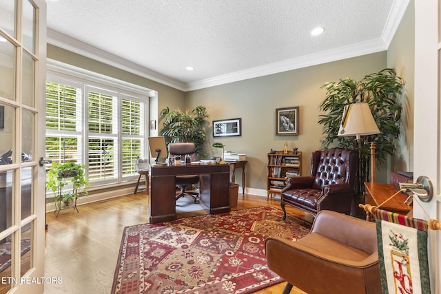 office space with ornamental molding, a textured ceiling, and wood finished floors