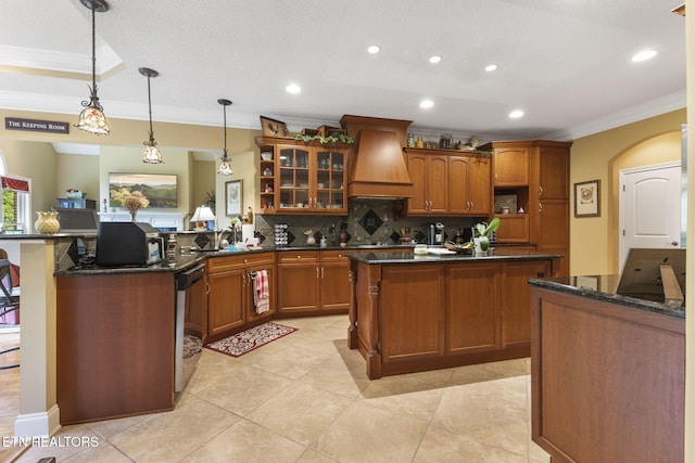 kitchen with custom range hood, open shelves, crown molding, and a peninsula