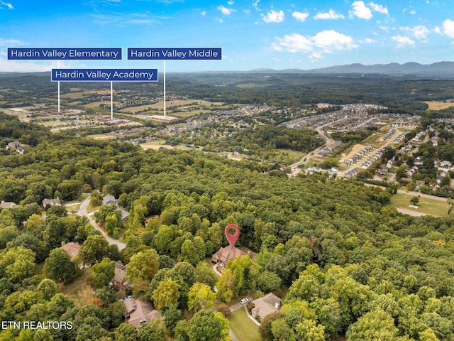 drone / aerial view featuring a forest view