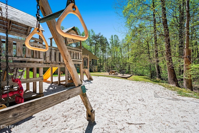 view of play area featuring a view of trees