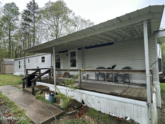 exterior space with an outbuilding and a storage shed